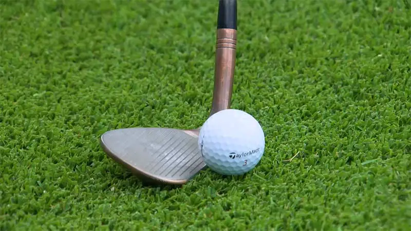 how to put backspin on golf ball